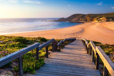 View down a boardwalk to beach on west coast of Algarve