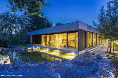 Villa at night with pool in the foreground