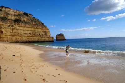 view along waterside of Caneiros beach towards Portimão