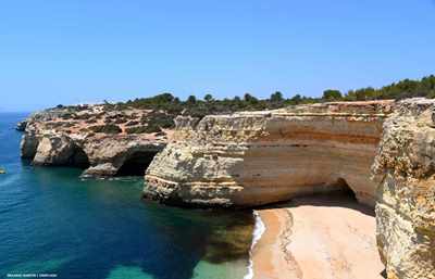 View crom clifftop down to amn Algarve beach and out to sea