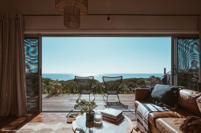 View to ocean through terrace doors and decking