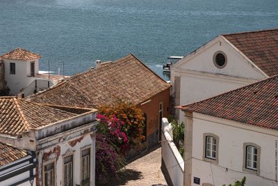 View of the ocean across Faro rooftops