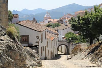Old village with cobbled streets and hills in the background