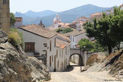 Old village with cobbled streets and hills in the background