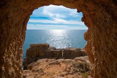 View through hole in rocks out to sea