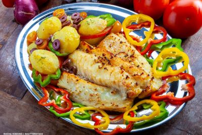 Dish of cod fish with salad