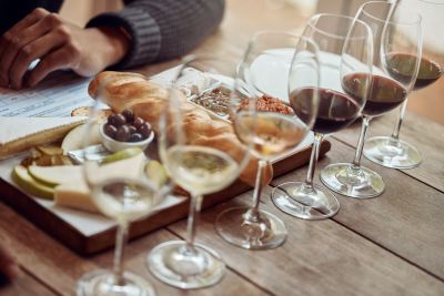 Wine in glasses with charcuterie platter