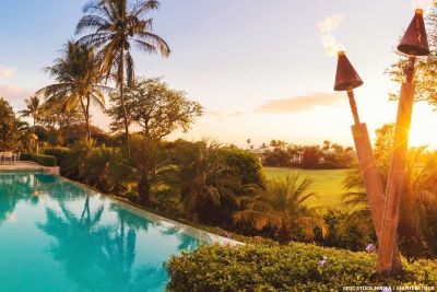 villa with pool overlooking golf course