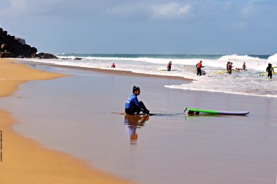 Surfers waiting for a good wave on Algarve coast
