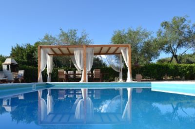 swimming pool with surroundign terrace and loungers